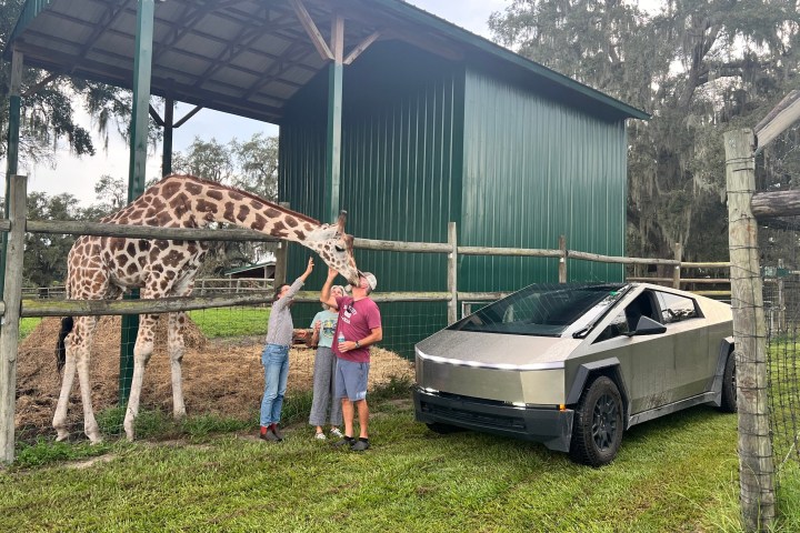 a group of people standing in front of a house