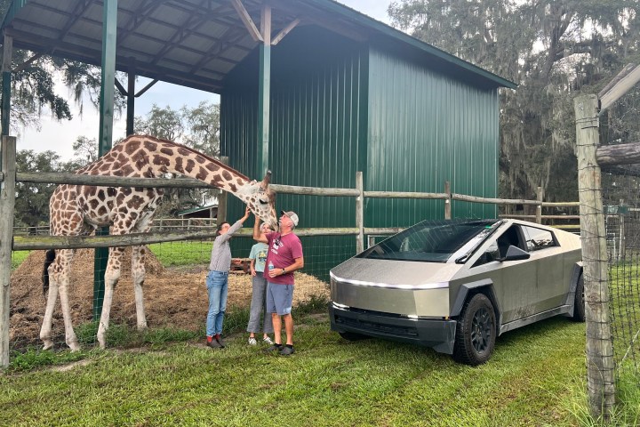 a group of people standing in front of a house